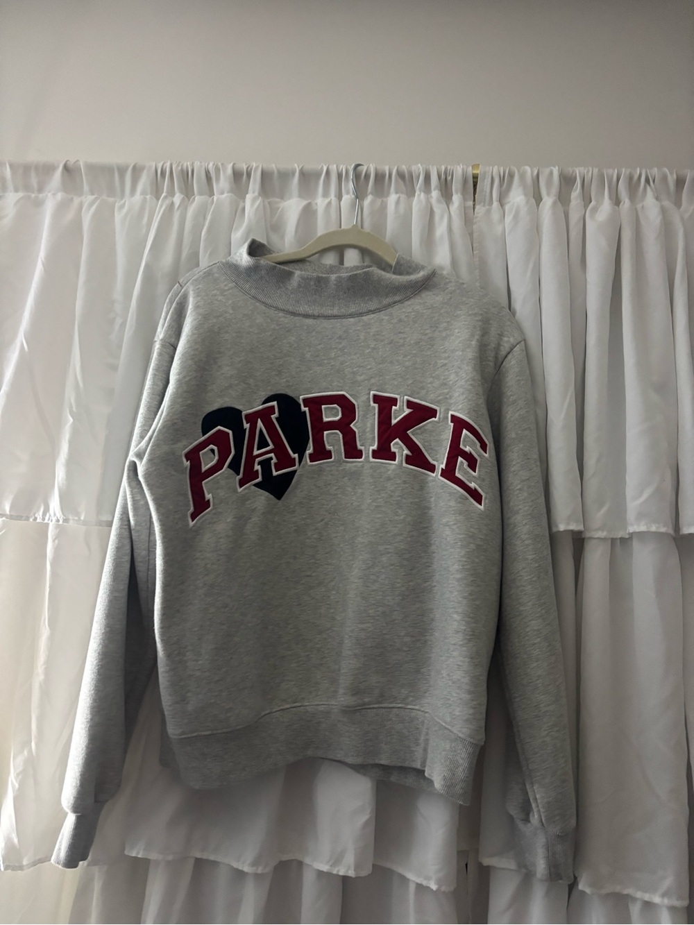 Grey Crewneck Sweatshirt with Red 'PARKE' Lettering and Black Heart